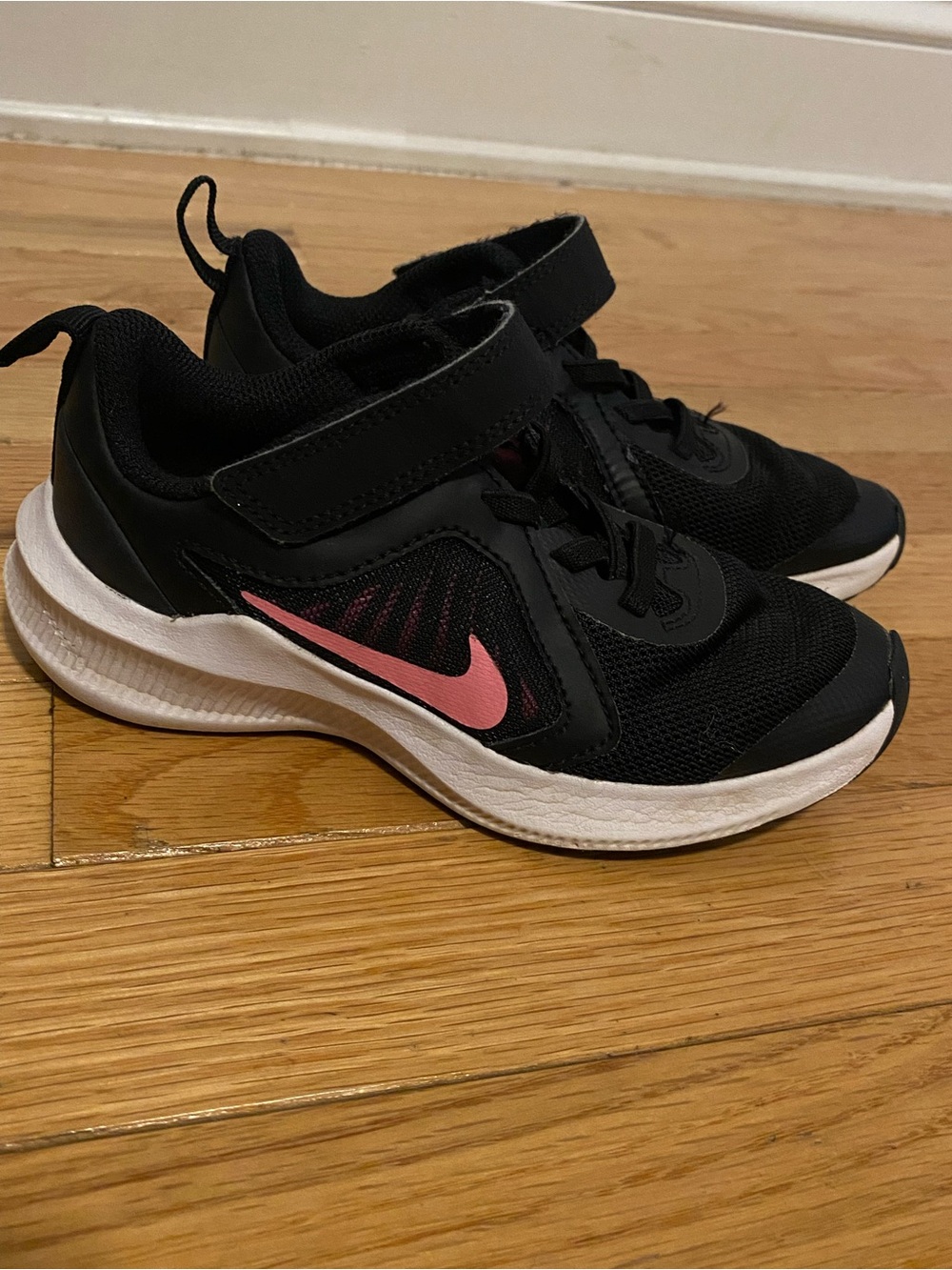 Nike Kids Black Sneakers with Pink Swoosh